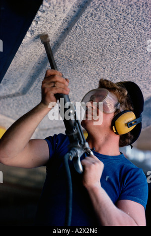 Close up of man. Travailleur de la construction en béton de forage. Banque D'Images