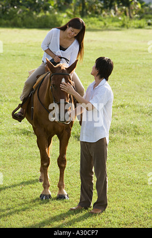 Couple l'équitation Banque D'Images