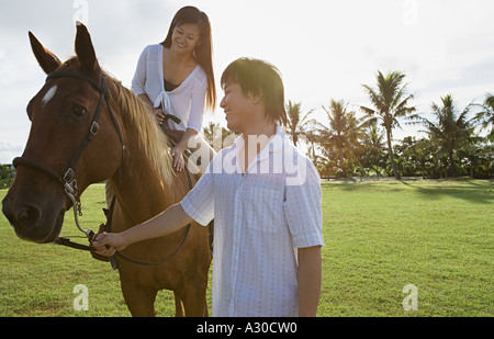Couple l'équitation Banque D'Images