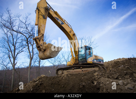 Une pelleteuse sur un site de construction Banque D'Images