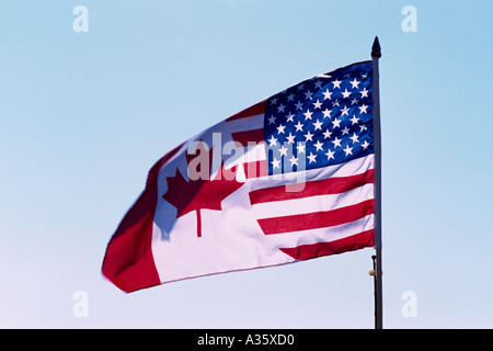 Drapeau Drapeau non officiel, de l'amitié unissant les drapeaux américains et canadiens, qui souffle dans le vent par un jour de vent Banque D'Images