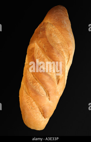 Miche de pain sur un fond noir Close Up Banque D'Images