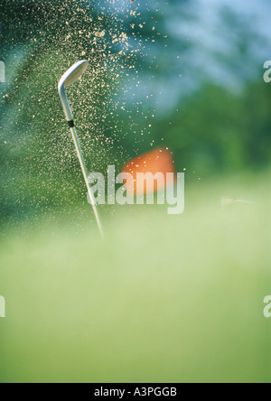 Golf Club et le sable dans les airs Banque D'Images