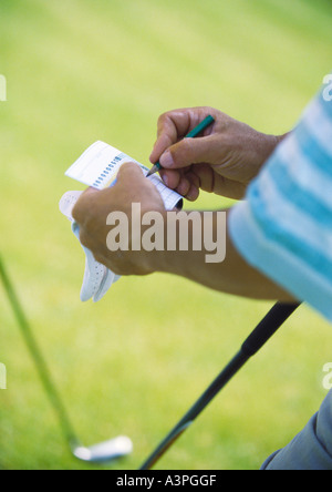 Golfeur Keeping Score, close-up Banque D'Images