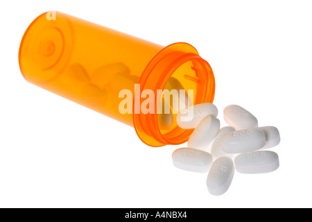 Bouteille de pilules avec pills spilling out Banque D'Images
