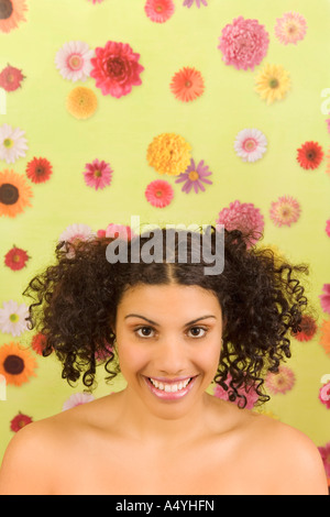 Portrait of woman in front of tulips Banque D'Images