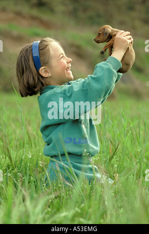 Chiot, petite fille Banque D'Images