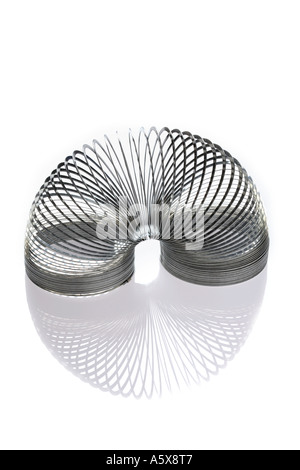 Slinky on reflective surface Banque D'Images