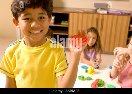 Portrait of boy with Painted Hand Banque D'Images