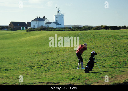 Golfeur et phare de Cromer Banque D'Images