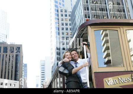 Mature couple riding a street car Banque D'Images