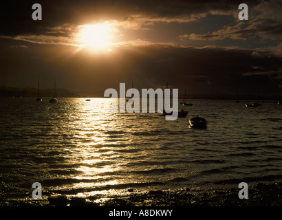 Stormy coucher sur l'estuaire à Lympstone Exe, Devon, Angleterre Banque D'Images