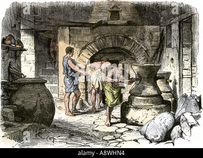 Esclaves moudre le grain dans une boulangerie à l'ancienne Pompéi. À la main, gravure sur bois Banque D'Images