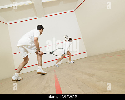 L'homme et la femme le squash Banque D'Images