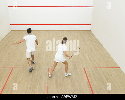 L'homme et la femme le squash Banque D'Images