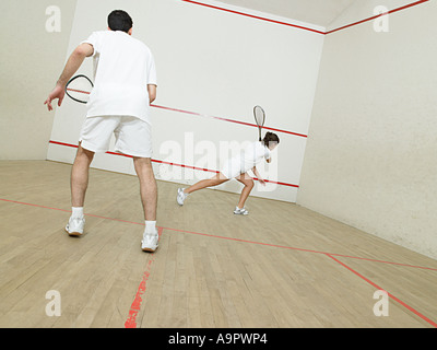 L'homme et la femme le squash Banque D'Images