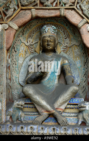 Statue de Bouddha sculptée à l'intérieur de l'ancien Grottes de Yungang, Datong, Shanxi, en Chine. Banque D'Images