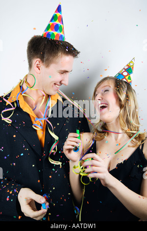 Young couple having fun at a party Banque D'Images