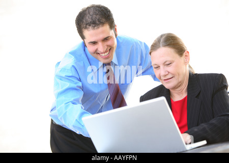 Businesspeople working together on laptop Banque D'Images