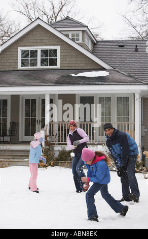 Family Having Snowball Fight