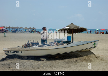 La cuisson du poisson frais malaga Banque D'Images