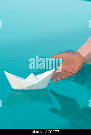 Poussant le concept de bateau Banque D'Images