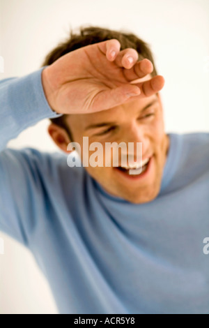 Jeune homme en riant, close-up Banque D'Images