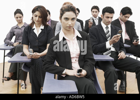 Groupe des cadres d'affaires sitting in a meeting Banque D'Images