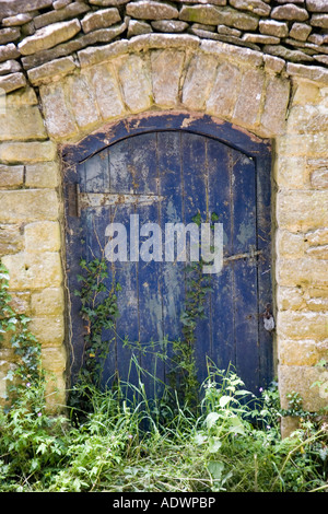 Porte dans mur de pierre Sandford St Martin Angleterre Royaume-Uni Banque D'Images