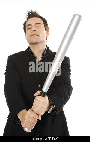 Young man holding Baseball bat, close-up Banque D'Images