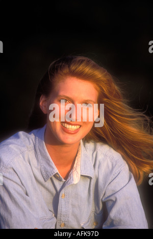 Portrait of smiling woman with red hair Model Image Parution Banque D'Images
