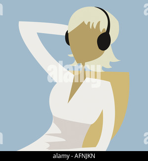 Young woman listening to music Banque D'Images