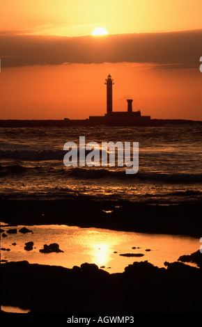 Phare au coucher du soleil / Faro de Toston / Leuchttum bei Sonnenuntergang Banque D'Images