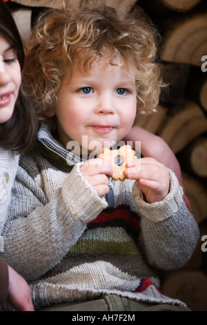 Close-up of a Boy eating a cookie Banque D'Images