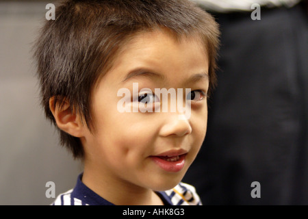 Cute Young Asian Boy Making Faces, Hong Kong Banque D'Images