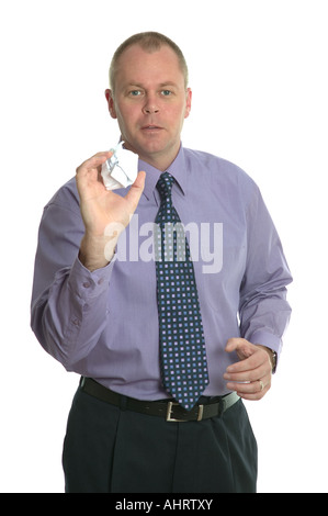 Businessman throwing a paper ball Banque D'Images