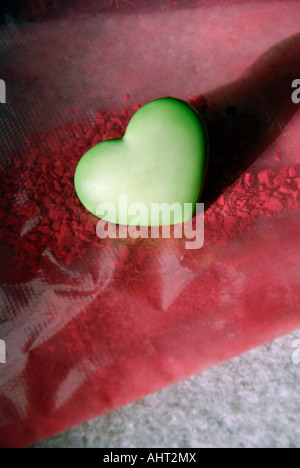 Coeur vert sur rouge miettes Pastel Banque D'Images