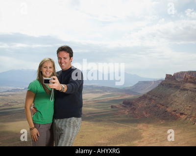 Couple taking own photograph Banque D'Images