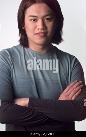 Portrait Asian man folding arms Banque D'Images