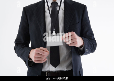 Businessman wearing ID card Banque D'Images