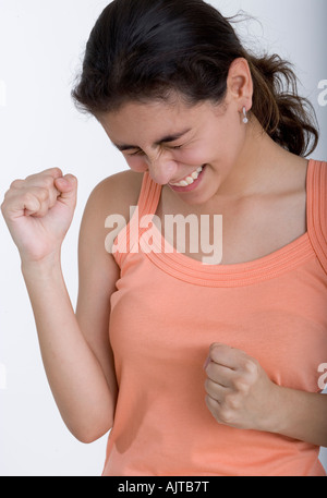 Young woman cheering avec ses yeux fermés Banque D'Images