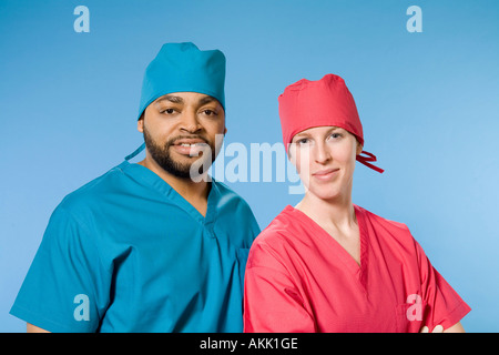 Close up portrait of two doctors wearing scrubs Banque D'Images