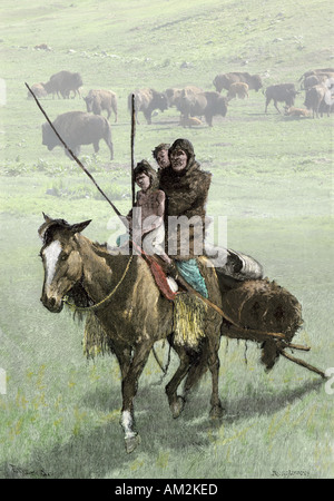 Native American family riding un cheval tirant un travois sur la prairie. À la main, gravure sur bois combinées numériquement avec une photo Banque D'Images