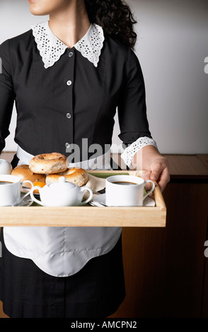 Maid Carrying Tray Banque D'Images