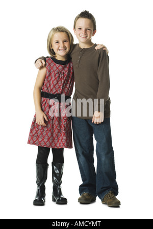 Boy and girl embracing and smiling Banque D'Images