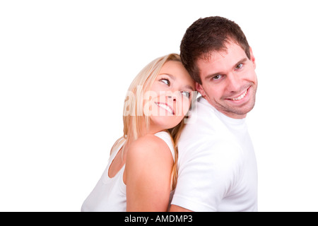 Happy young couple dos à dos Banque D'Images