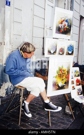 Artiste de rue, vente de peintures en Place du Tertre, Montmartre, Paris, France Banque D'Images
