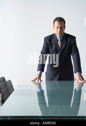 Businessman in Boardroom Banque D'Images