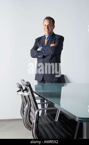 Businessman in Boardroom Banque D'Images