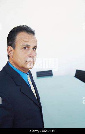 Businessman in Boardroom Banque D'Images